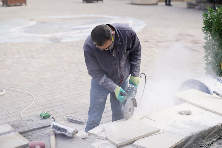Adelaide tradesman laying bluestone pavers on compacted crushed rock base